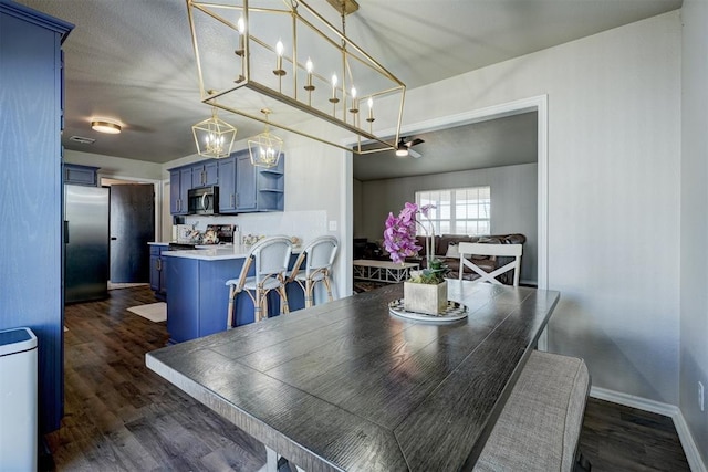 dining room with dark hardwood / wood-style flooring