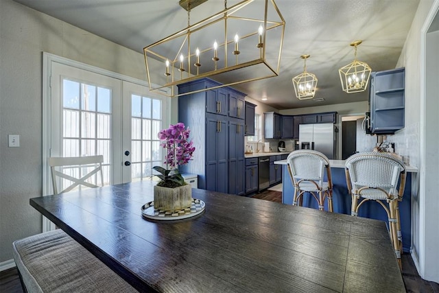 dining area with french doors and dark wood-type flooring