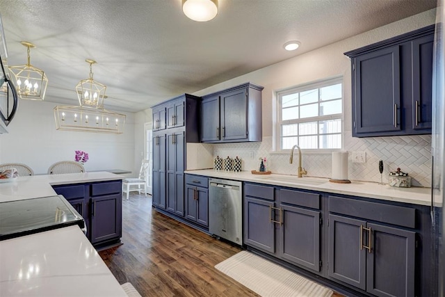 kitchen featuring pendant lighting, dishwasher, sink, dark hardwood / wood-style flooring, and a chandelier