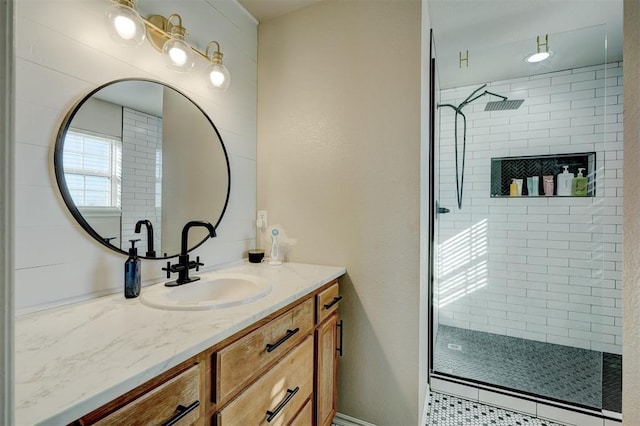 bathroom featuring vanity and a tile shower