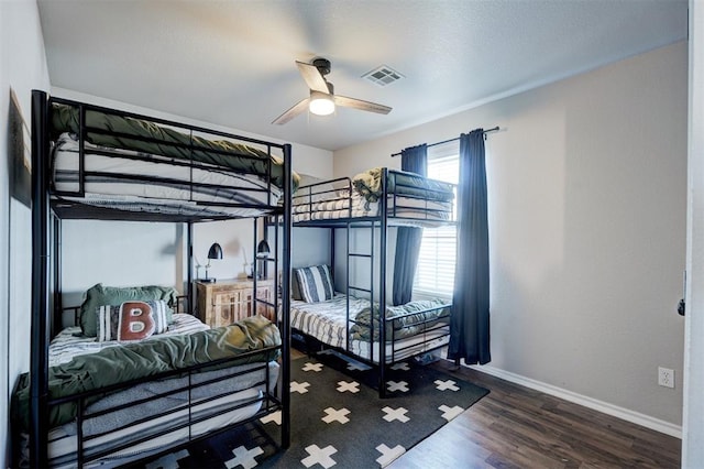 bedroom featuring dark hardwood / wood-style floors and ceiling fan