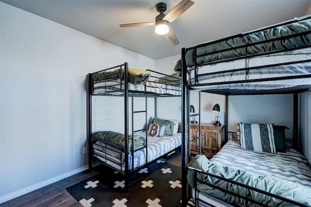 bedroom featuring ceiling fan and dark hardwood / wood-style flooring