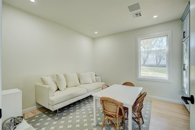 living room with light hardwood / wood-style flooring