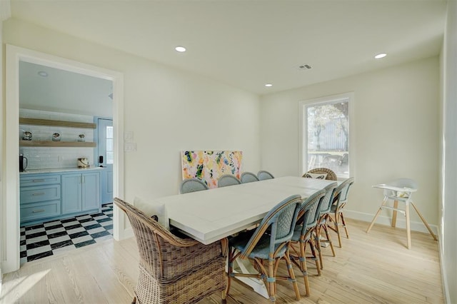 dining room with light wood-type flooring