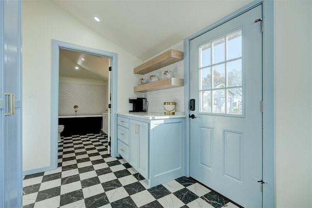 entryway with vaulted ceiling