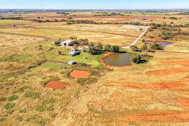 birds eye view of property with a rural view and a water view