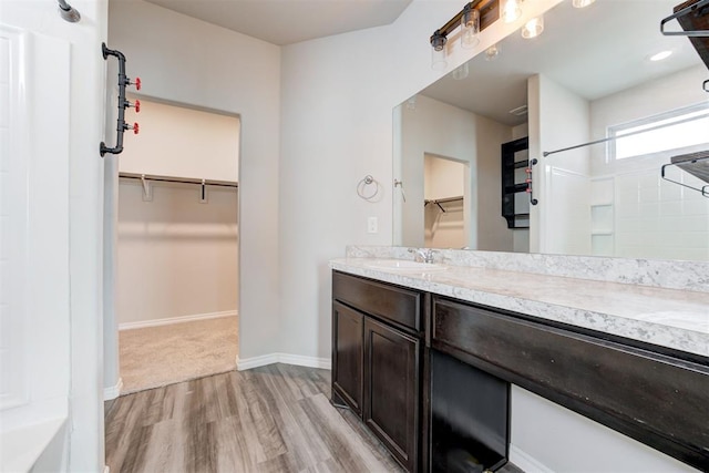 bathroom with hardwood / wood-style floors and vanity