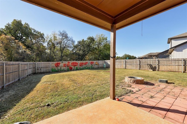 view of yard with a patio area and a fire pit