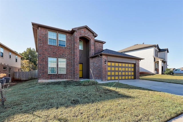 view of front of property with a front lawn and central AC