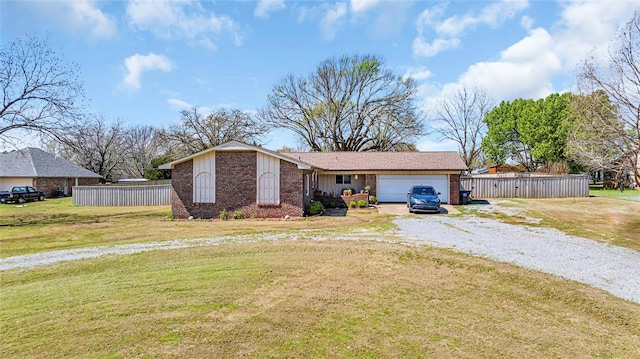 single story home with a garage and a front yard