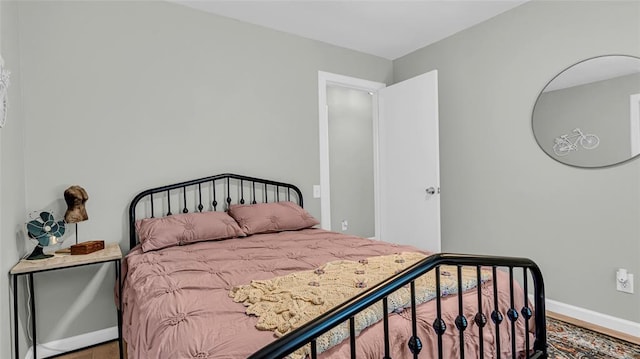 bedroom featuring wood-type flooring