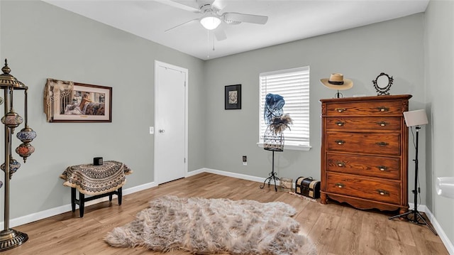 sitting room with ceiling fan and light hardwood / wood-style floors