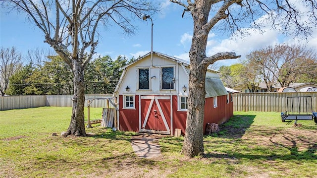 view of outbuilding with a yard