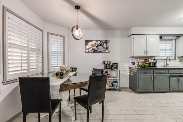 dining room featuring sink