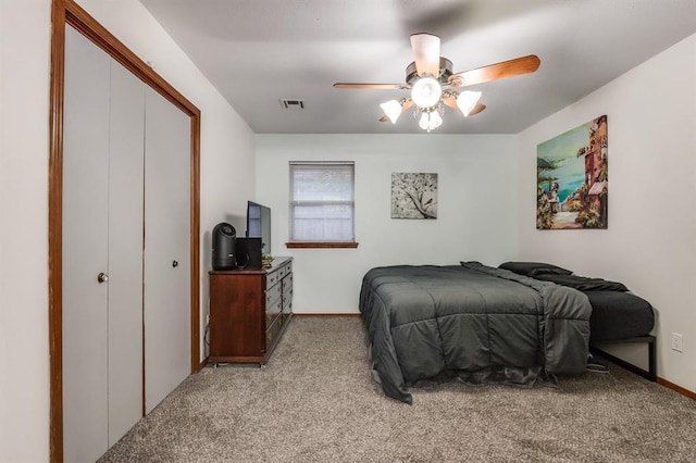 bedroom featuring light carpet, a closet, and ceiling fan