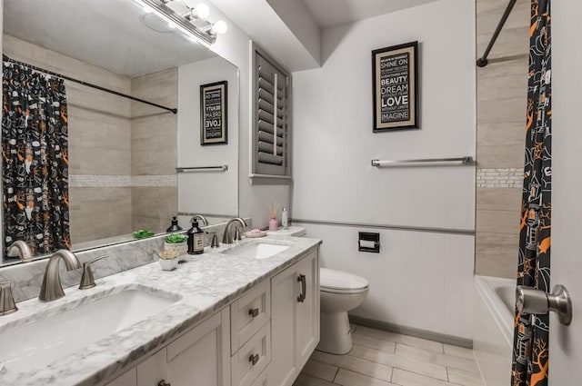 full bathroom featuring vanity, shower / tub combo, and toilet