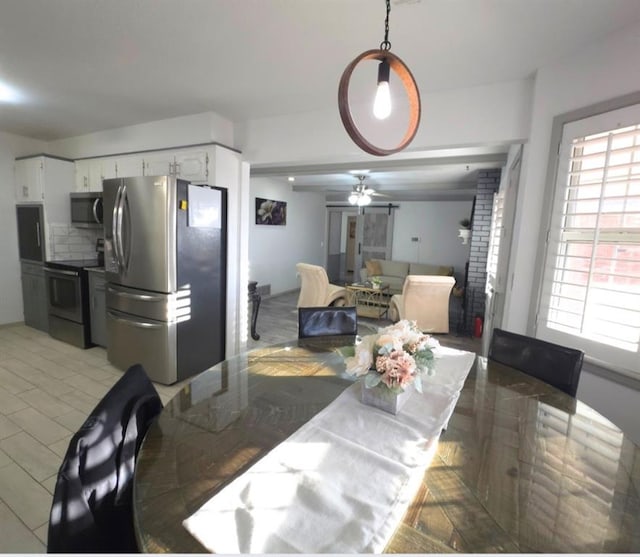 dining room featuring plenty of natural light and ceiling fan