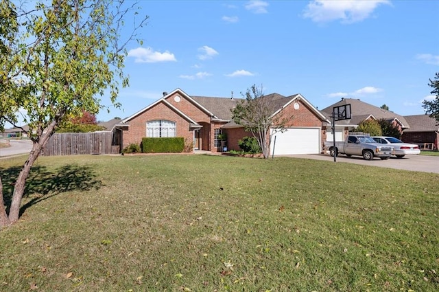 view of front of property with a garage and a front lawn