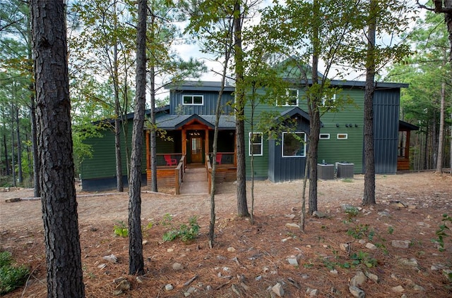 view of front of house with covered porch and central air condition unit