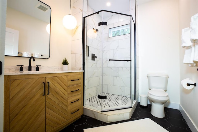 bathroom with tile patterned flooring, vanity, toilet, and a shower with door