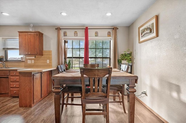 dining space featuring light wood-type flooring