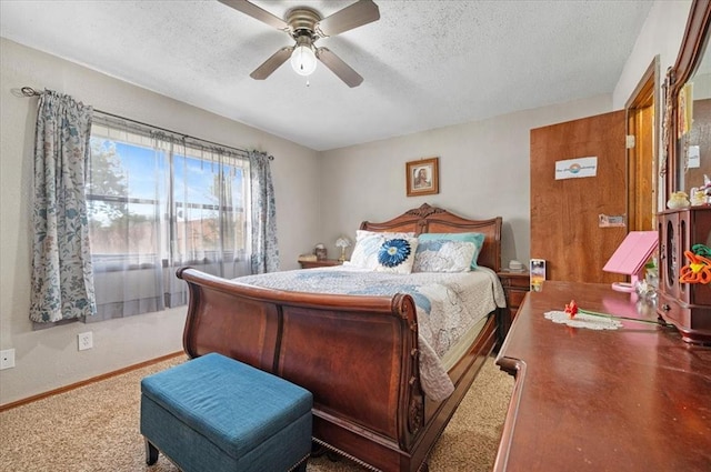 bedroom with ceiling fan and a textured ceiling