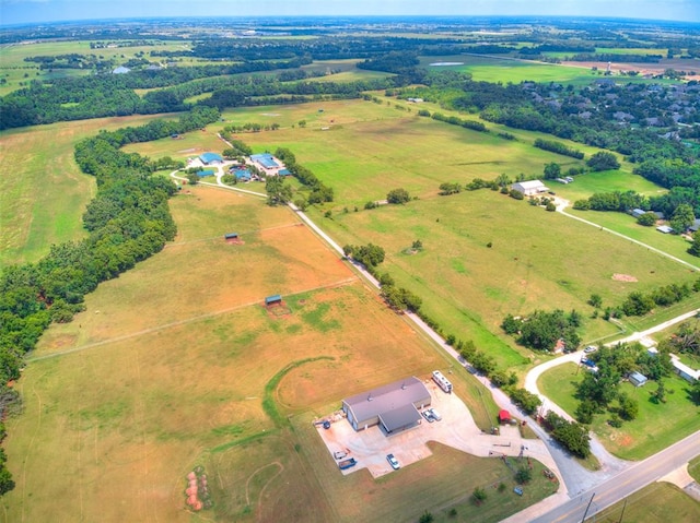 birds eye view of property featuring a rural view