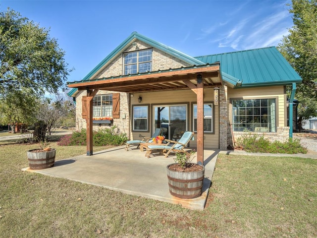 exterior space with a yard and a patio area