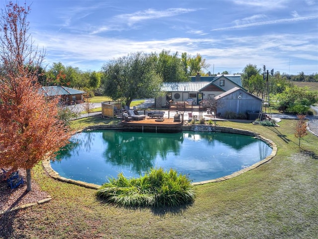 view of swimming pool with a yard and a deck