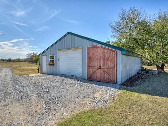 garage featuring a lawn