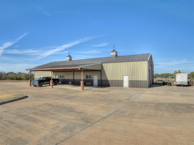 view of outbuilding with a carport