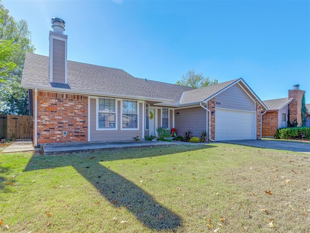 single story home featuring a front yard and a garage