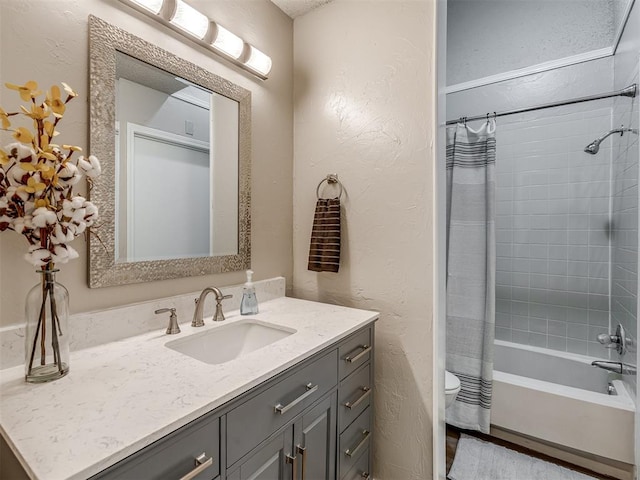 full bathroom with shower / bath combo, vanity, and toilet