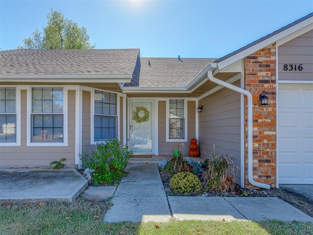 property entrance with a garage