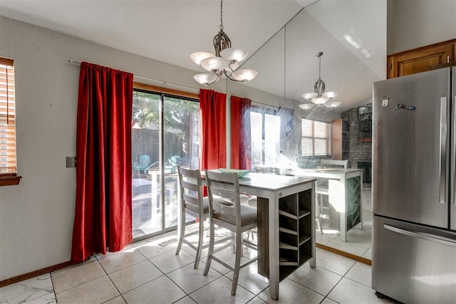 unfurnished dining area featuring vaulted ceiling and a notable chandelier