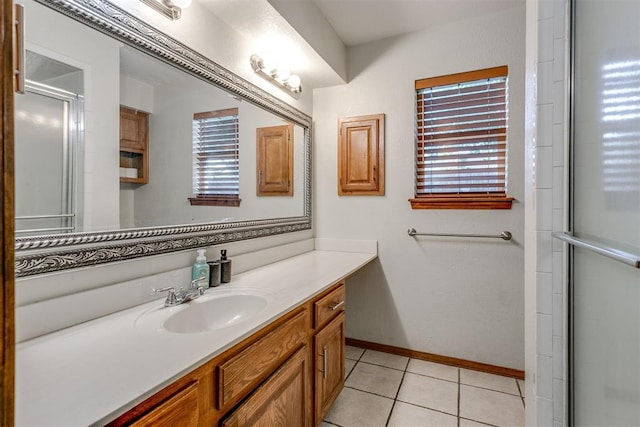 bathroom featuring tile patterned floors, vanity, and an enclosed shower