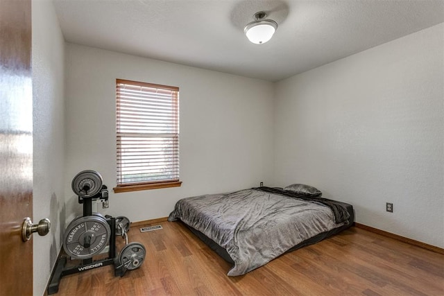 bedroom featuring hardwood / wood-style flooring