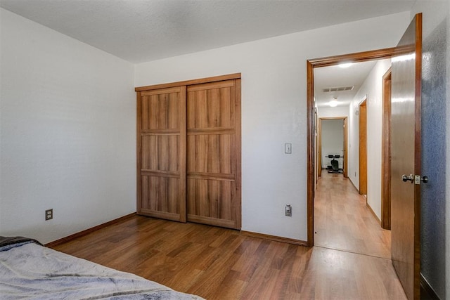 unfurnished bedroom with light wood-type flooring