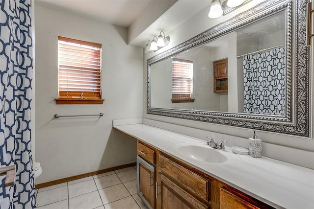 bathroom featuring curtained shower, tile patterned flooring, vanity, and toilet