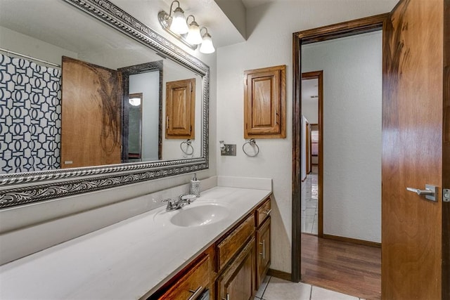 bathroom with hardwood / wood-style floors and vanity