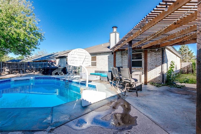 view of swimming pool featuring a patio area and a pergola