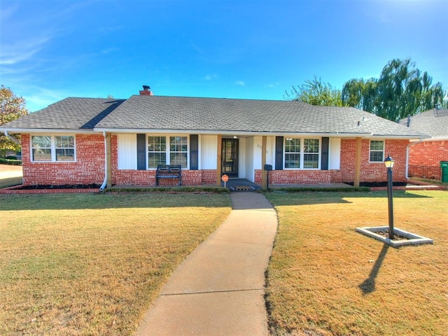 ranch-style home with a front yard