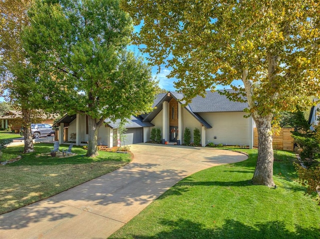 view of front facade with a front yard and a garage