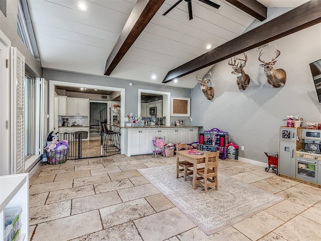 interior space featuring lofted ceiling with beams