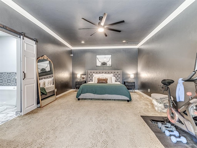 bedroom featuring ceiling fan, a barn door, carpet floors, and crown molding