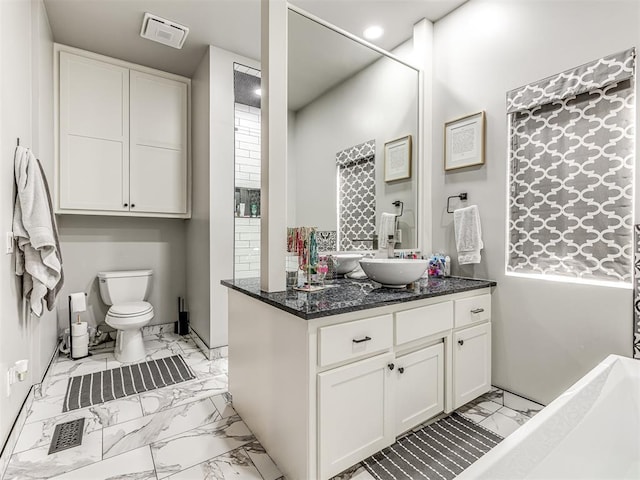 bathroom with vanity and toilet