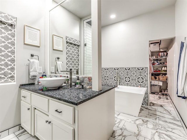 bathroom featuring a bathing tub and vanity