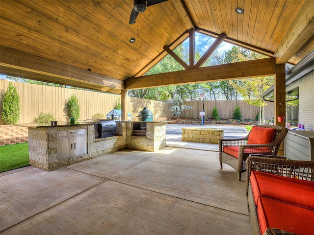 view of patio / terrace with a gazebo, a grill, ceiling fan, and an outdoor kitchen