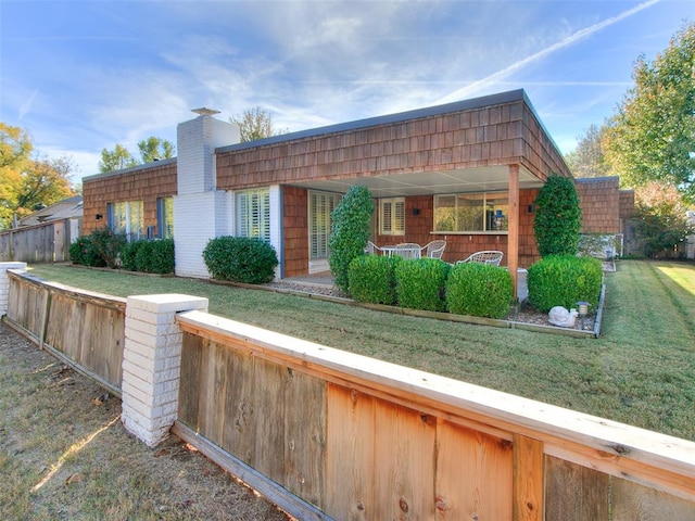 exterior space with a front yard