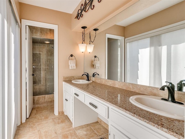 bathroom with vanity and a shower with door